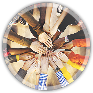 people in a circle with hands in the middle to show diversity